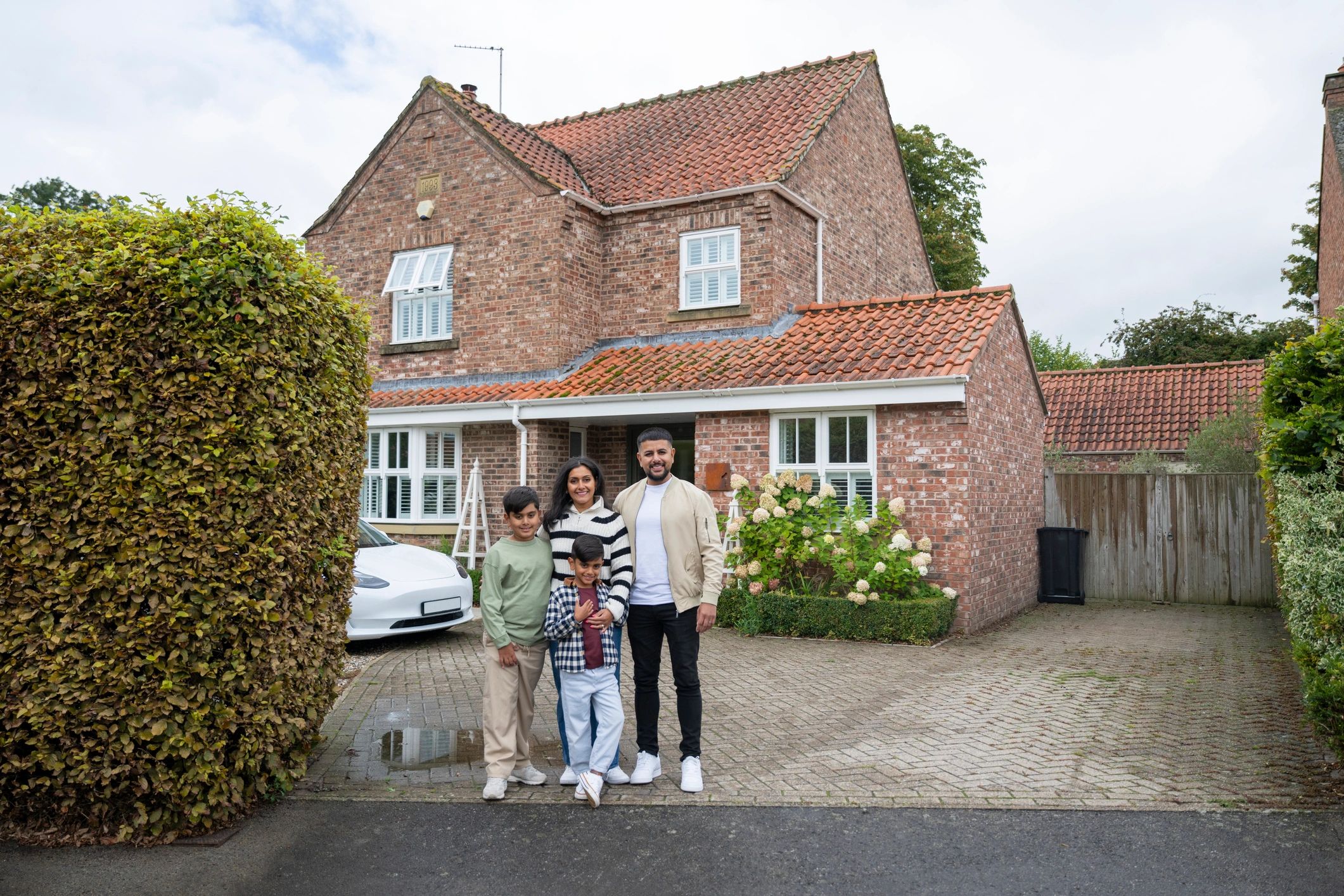 Family outside a house